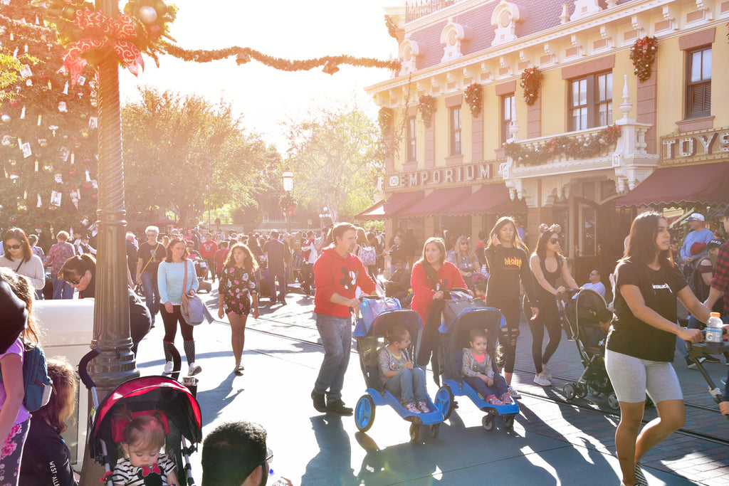 Familys and guests walking down Main Street, USA, in Disneyland